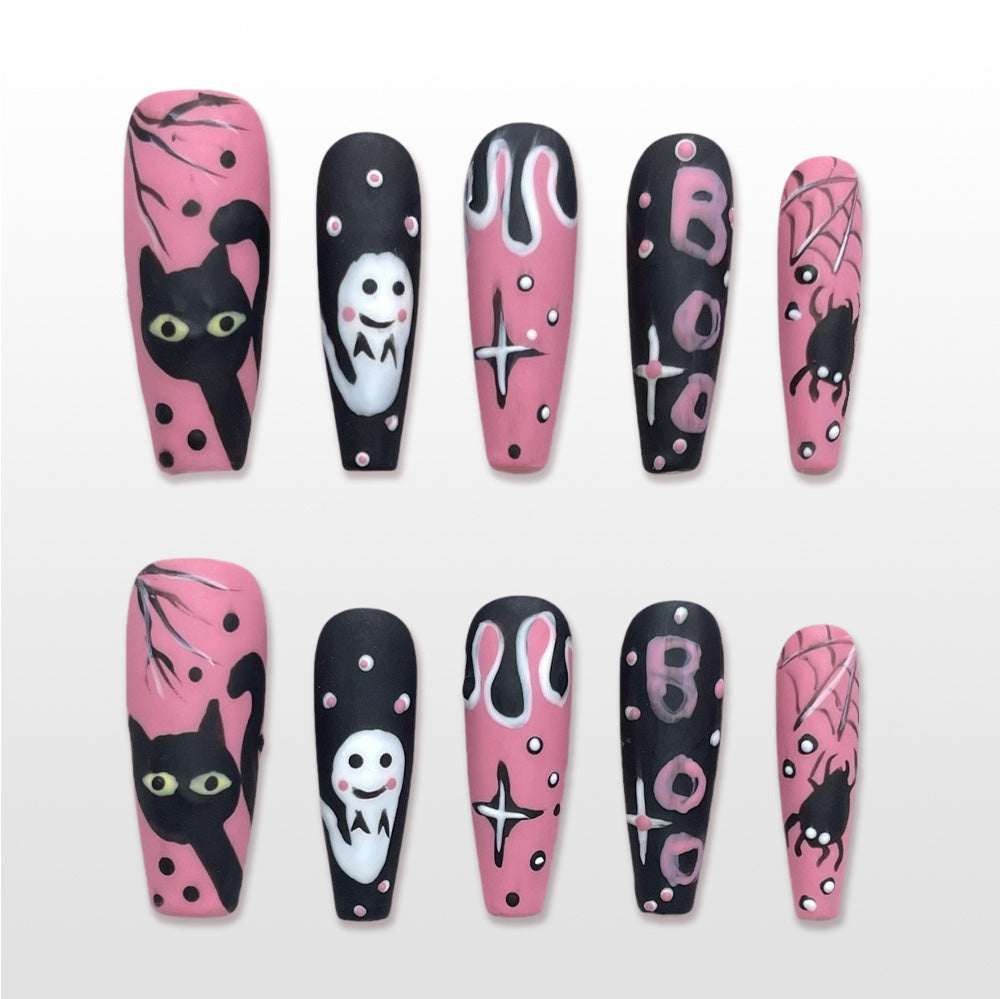 Handmade pink and black Halloween press on nails with ghost, black cat, spider and BOO design