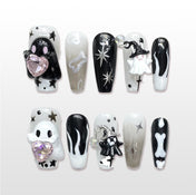 Handmade black and white Halloween press on nails with ghost, bones and star design