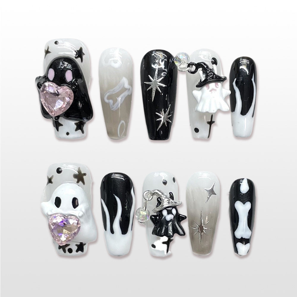 Handmade black and white Halloween press on nails with ghost, bones and star design