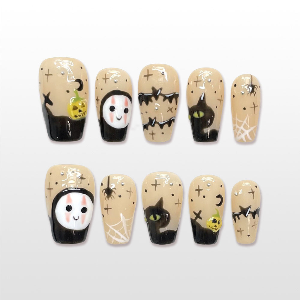 Handmade beige Halloween press on nails with ghost face, black cat and spiderweb design