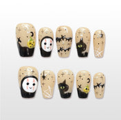 Handmade beige Halloween press on nails with ghost face, black cat and spiderweb design