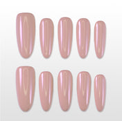 Handmade nude pink press on nails with glossy pearl finish, almond shape