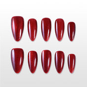 Handmade red acrylic nails with shimmer effect, reusable press ons
