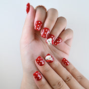 Cute red short square nails with white dots and cartoon accent