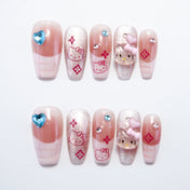 Handmade glitter French nails featuring 3D Hello Kitty charms and heart gems