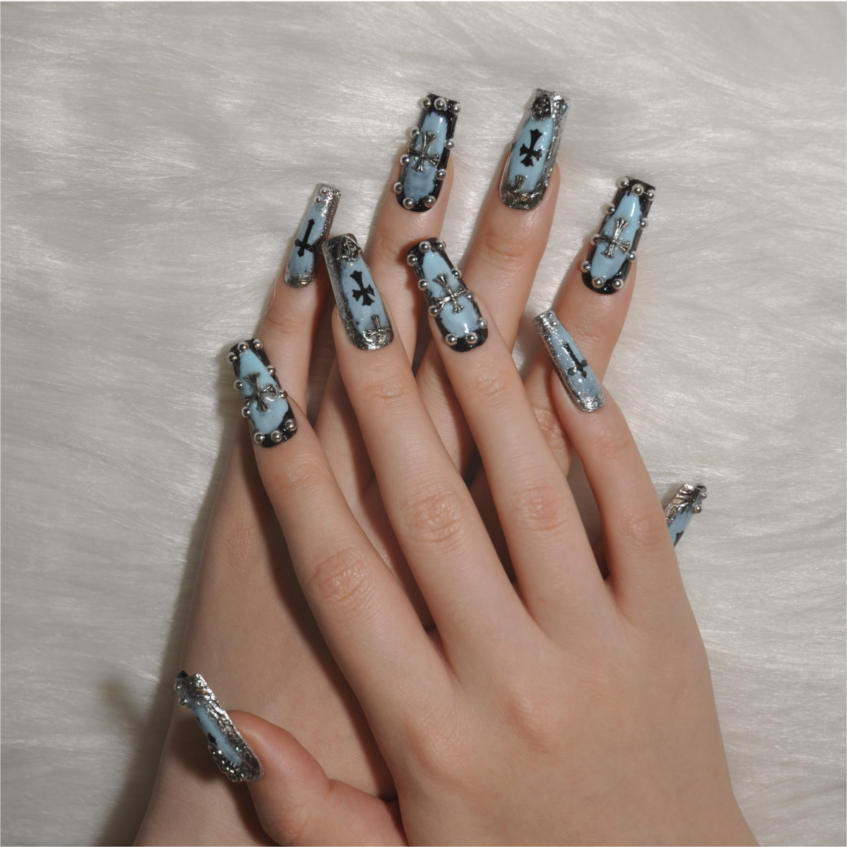 Edgy black and light blue press-on nails with gothic cross design 