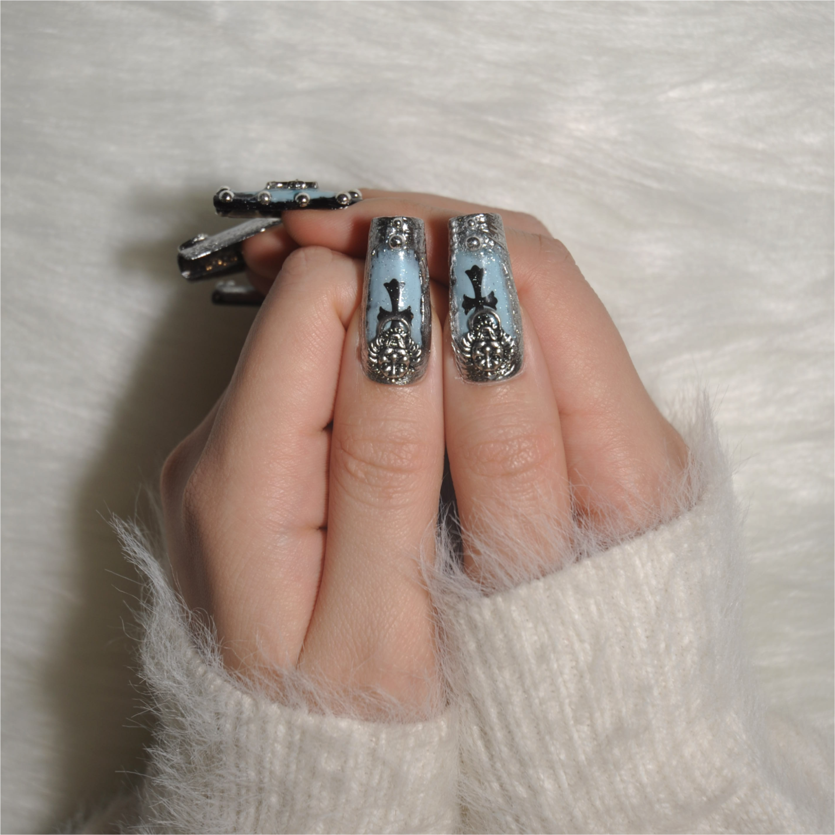 Punk style square nails with lion emblem and silver 3D details