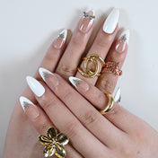 Minimalist nude and white press-on nails with 3D silver bow and star details