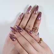 Futuristic press-on nails with shimmering duochrome effect in copper and violet tones