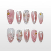 Charmeenail mermaidcore press on nails with shell texture, pearls, and gold starfish charms