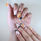 Reusable medium acrylic nails by Charmeenail, orange and black Halloween themed nail art