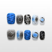 Abstract blue and black press-on nails with silver textured accents