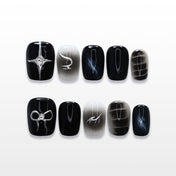 Black and white gradient press-on nails with cat-eye effect and minimal line art